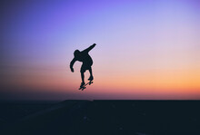 Skateboarder In Action, Silhouette Unrecognizable.