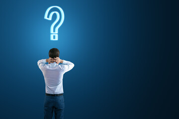 Poster - Back view to a thoughtful businessman and a question mark on his head on a dark blue background with empty space, search for a solution and doubt concept, mockup