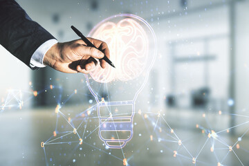 Poster - Man hand with pen draws abstract virtual light bulb illustration with human brain on blurred office background, future technology concept. Multiexposure
