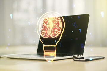 Wall Mural - Creative light bulb with human brain hologram on modern laptop background, artificial Intelligence and neural networks concept. Multiexposure