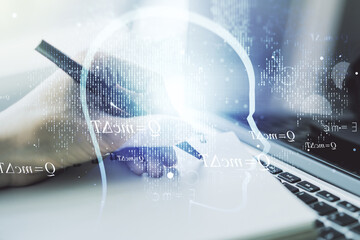 Poster - Creative artificial Intelligence concept with human head hologram and hand writing in notebook on background with laptop. Multiexposure