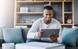 © Angelo/peopleimages.com - Smile, tablet and man on sofa on social media meme, email or streaming video on subscription service. Happiness, internet and networking, happy male surfing online and movie website on couch in home.