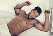 © Mr. Skin/peopleimages.com - Portrait, naked and man in a bed in the morning, fitness and muscular at home, serious and confident. Face, male person and guy in the bedroom, muscle and sexy with wellness, nude and shirtless