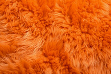 Very Peri Orange Color Sheep Fur Sheepskin Rug Background Wool Texture. AI Generative
