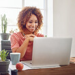 © Anne B/peopleimages.com - Happy woman, business student and laptop for planning at desk, technology and internet in agency. Young african female, office intern and working on computer, website and smile for online research