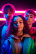 © jfStock - Portrait of Diversity: Young Men and Women of All Ages in Vibrant Neon Hues. generative ai.