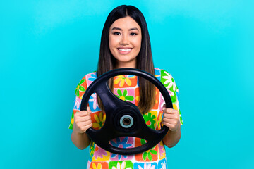 Sticker - Photo of satisfied japanese young lady hold steering wheel driving confident new automobile isolated on aquamarine color background