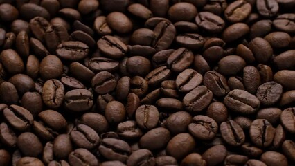 Wall Mural - Frame zoom dark roast coffee beans top view, rotate