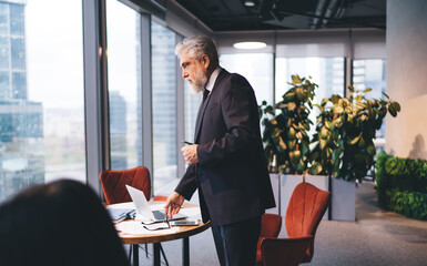 Sticker - Pensive senior businessman working in office