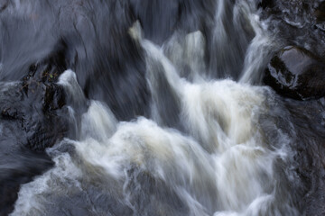 Wall Mural - River cascading over and around rocks