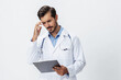 © SHOTPRIME STUDIO - Man doctor in white coat with stethoscope and record folder and patient chart unhappy angry on white isolated background, copy space, space for text, health