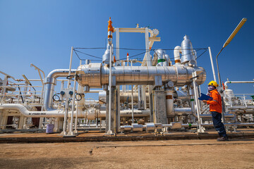 Male worker inspection at the exchanger of tank oil refinery pipeline plant steam vessel and column tank oil of Petrochemistry