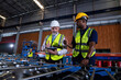 © Tongpool - Plant manager visit engineer in factory at production line discuss on quality assurance improvement