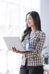 Young asian woman, professional entrepreneur standing in office clothing, smiling and looking confident, plan office space after working hours,
