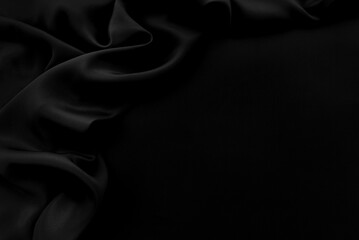 Texture of satin or silk fabric in black color. Textile. Fabric background with folds and waves