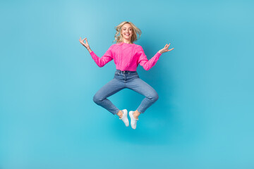 Wall Mural - Full body photo of young relaxed closed eyes woman jumping balance asana meditation concentrated herself isolated on blue color background