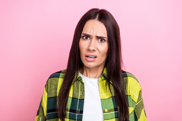 Poster - Photo of suspicious angry woman dressed plaid shirt looking you isolated pink color background