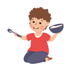 Sticker - Cute preschool little boy sitting on floor holding bowl of porridge and spoon cartoon vector illustration