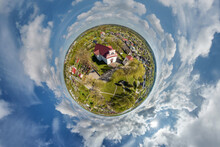 Little Planet Transformation Of Spherical Panorama 360 Degrees Overlooking Church In Center Of Globe In Blue Sky. Spherical Abstract Aerial View With Curvature Of Space.