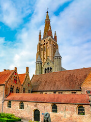 Wall Mural - Church of Our Lady tower in center of Brugge, Belgium