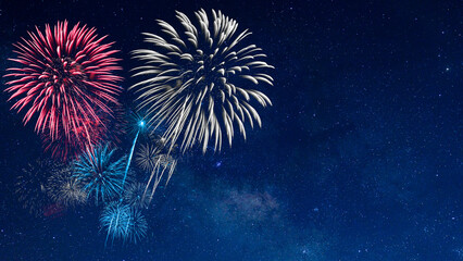 Wall Mural - red and blue firework with blur milky way background