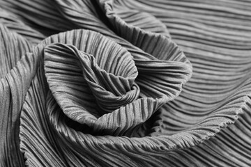Blank grey twisted fabric material. Crumpled fabric texture. Wrinkled textile as background texture