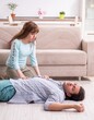 © Elnur - Young couple in first aid concept at home