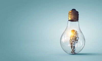 Wall Mural - spaceman inside light bulb . mixed media