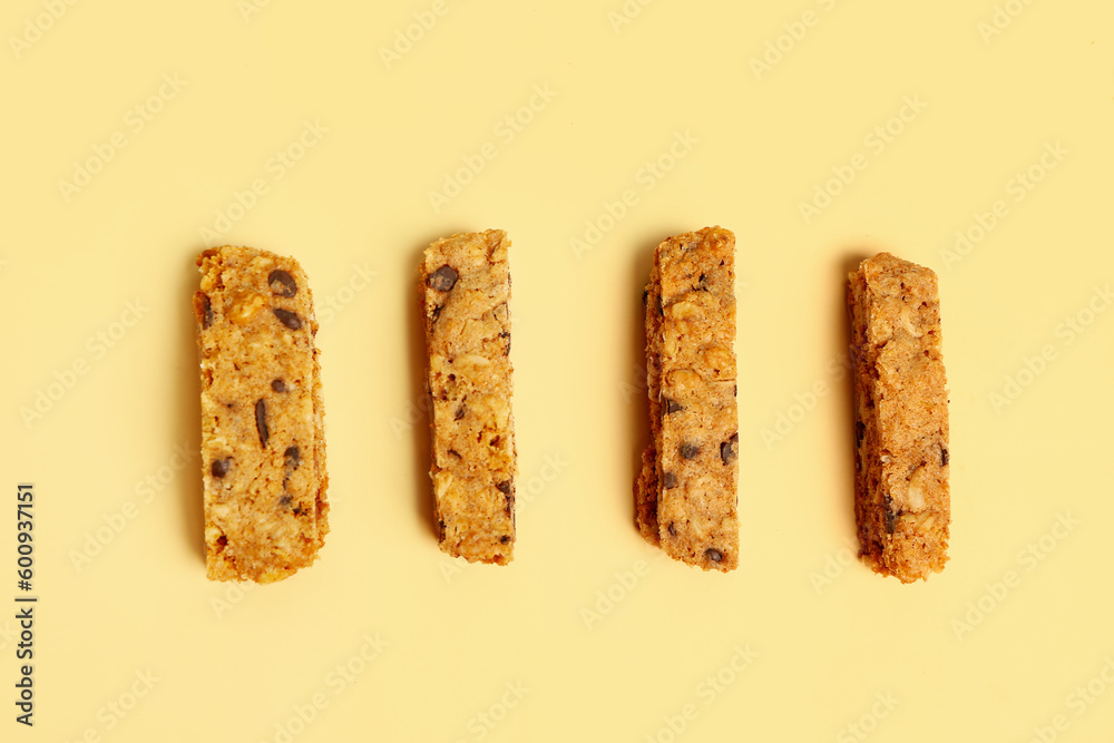 Tasty biscotti cookies on yellow background