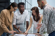 © Katsiaryna - Ambitious smart employee speaks in a meeting and shares her opinion on a creative idea in a group briefing