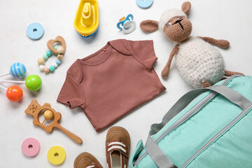 Wall Mural - Composition with baby clothes and toys on white background