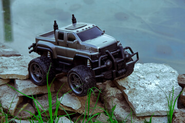 Radio-controlled children's car models. gray SUV truck, toys with remote control. Free time. A concept for children and adults. Hobby. Toys.	