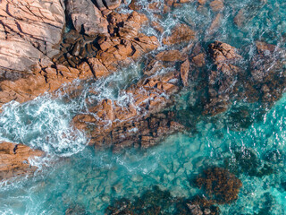 Wall Mural - Aerial top down view of beach and clear blue water. Ocean waves on the beach as a background. Beautiful natural summer vacation holidays background. Eagle Bay, Western Australia. Coastal seascapes