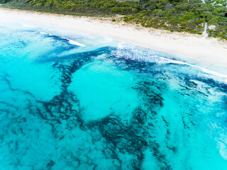Wall Mural - Aerial top down view of beach and clear blue water. Ocean waves on the beach as a background. Beautiful natural summer vacation holidays background. Eagle Bay, Western Australia. Coastal seascapes