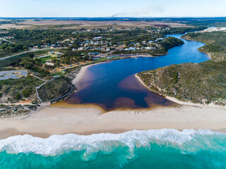 Wall Mural - Aerial view of where the river meets the sea in Guilderton, Western Australia, Australia. Beach, seascapes, coastal