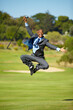 Man, golf and jump for celebration, excited face or portrait for winning, achievement or goal outdoor. African businessman, golfer and corporate winner at sport pitch with suit, freedom or fitness