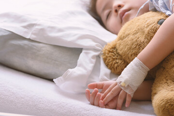 Little Asian Thai Girl, Recovering Sleep on white patient Bed .