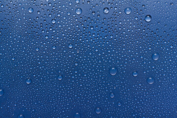  Water drops on color background, top view