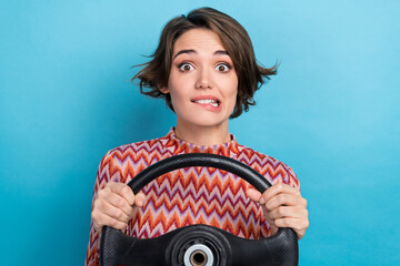 Poster - Photo of doubtful uncertain woman dressed pink shirt biting lips stack traffic jam isolated blue color background