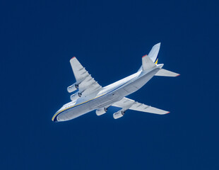 Wall Mural - Four engined cargo jet in the sky.