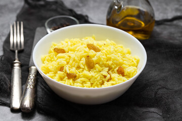 Poster - Yellow rice with dried fruit in white bowl