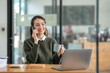 © crizzystudio - Beautiful and confident Asian businesswoman holding a cup of coffee to drink during break Relax with your own business happily in the office.