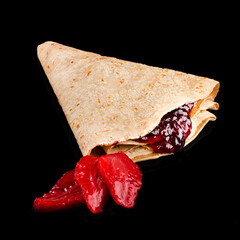 Poster - Fried sweet thin pancakes with jam and fresh strawberry on black background.