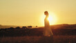 © francescosgura - Girl walks barefoot in the countryside at sunset