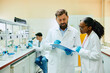 © Drazen - Two scientists cooperating while analyzing research data in laboratory.