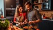 © Oliver - Couple cooking at kitchen stove
