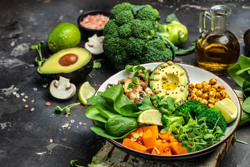 Wall Mural - Buddha bowl, Avocado, mushrooms, broccoli, spinach, chickpeas, pumpkin. healthy and balanced food. Top view