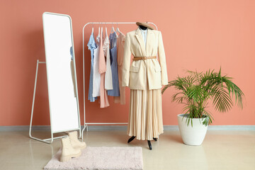 Poster - Interior of fashion designer's studio with mannequin, rack and clothes