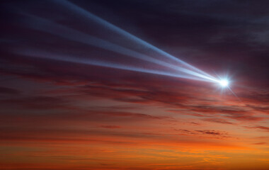 Wall Mural - comet, asteroid, meteorite flying on the background of the evening sky. glowing asteroid and tail of