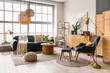 © Pixel-Shot - Interior of stylish living room with cozy sofa and coffee table near big window